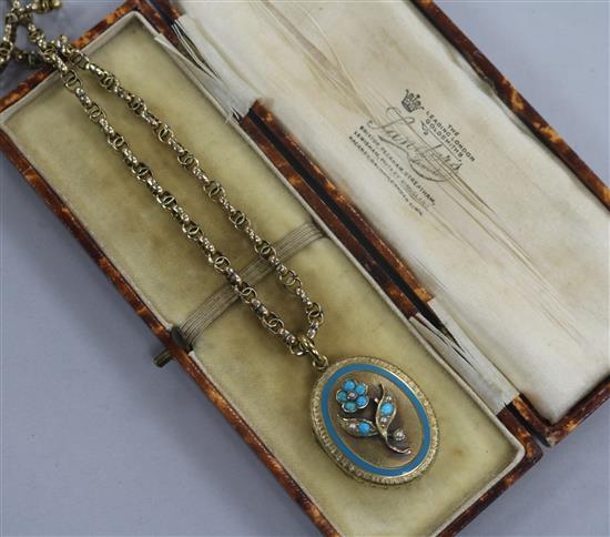 A Victorian yellow metal, turquoise and seed pearl set oval locket, on a 9ct gold chain, locket 30mm.